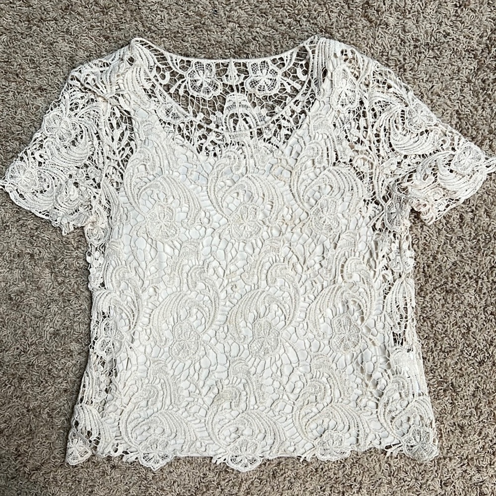 Lace top, size large. Attached tank top. Pet and smoke free home.